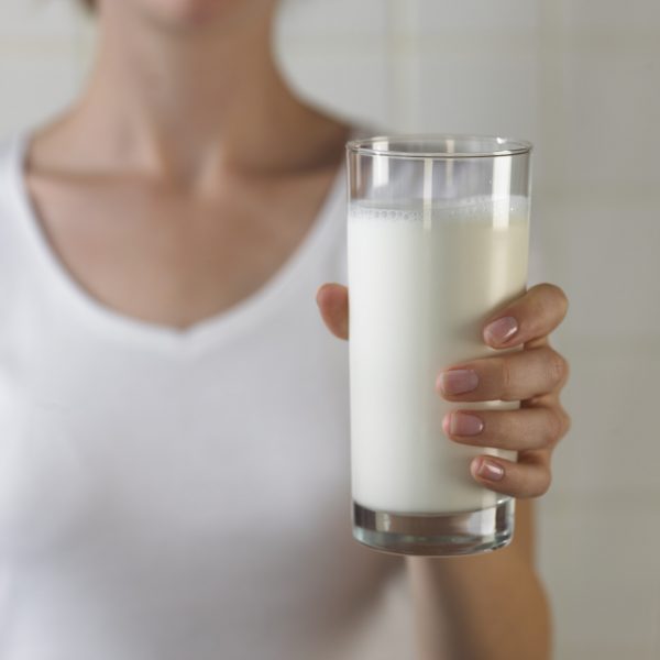 Holding glass of milk