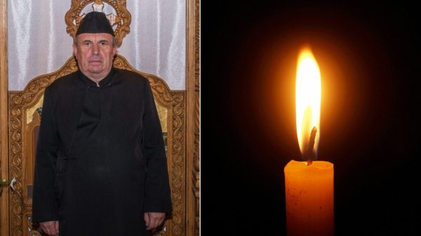 In imagine se afla Parintele Daniel Florea si o lumanare.